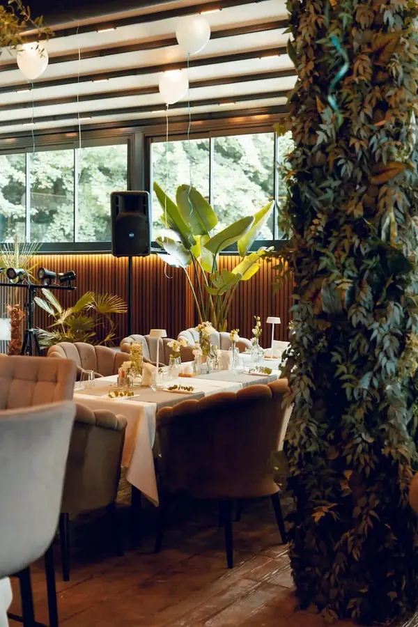 Green wall and a set table on the George & Dragon events terrace